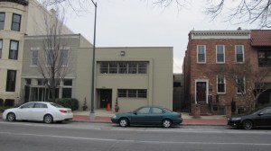 Two new town houses are slated to replace this white brick building facing Stanton Park, at 513 C Street, NE