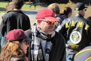 Local Navy veteran Mark Shlein talks with neighbors after ceremony