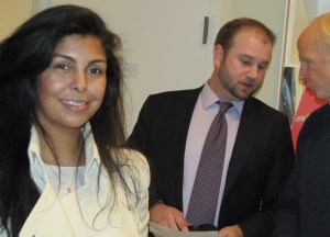 Manelle Martino, co-founder of Capital Teas.  BRMS Martin Smith (center) confers with BRMS President David Perry in background. 