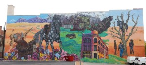 A Mural the Width of a City Block on Main Street in Pueblo References the Devastation of the 1921 Flood, the Town's Former Importance as a Saddle Manufacturing Center, and Its Latino Heritage. 