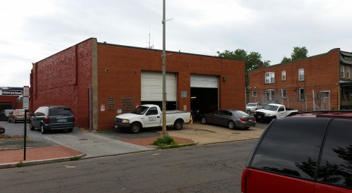 Photos show the site from left to right, facing South, viewed from the north side of E Street