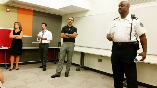 MPD First District Lt. Eddie Fowler.  In background, l-r, Nichole Opkins, office of CM Allen, Seth Shapiro, office of the Mayor, Ali Noorani, NE resident who organized the meeting.