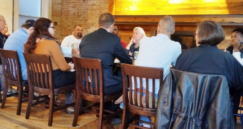 Starbucks District Manager Ronny Correa (center, back to camera) tells ANC Commissioners Jayaraman and Symolak and members of the community that Starbucks will go the extra mile on trash and rodent control