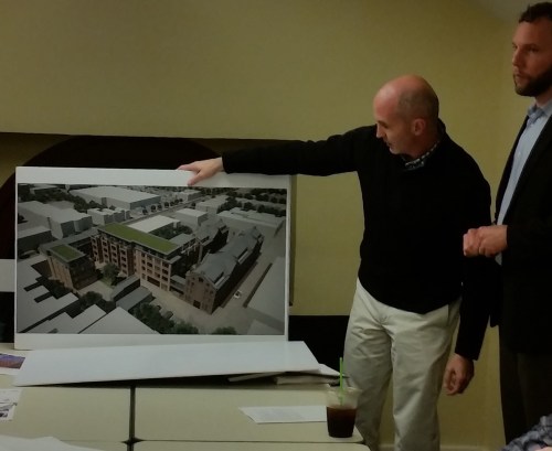 Sean Ruppert of Opal LLC, hold depiction of aerial view of Watkins Alley looking Northeast.  The large white structure at the top of the rendering is Safeway.  The white structure just below it is Frager's.  