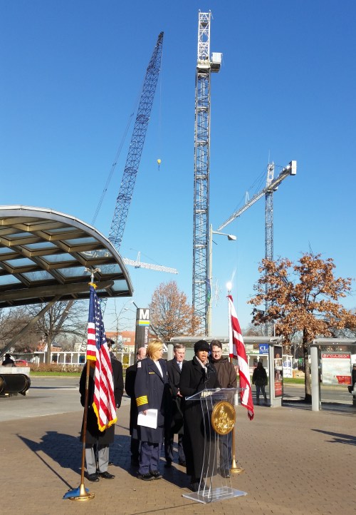 The Mayor's introductory remarks were followed by city officials explaining the work of the new Robbery Intervention Task Force.  The cranes in the background are on the Hine Development constructions site. 