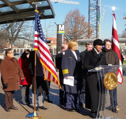 Mayor Bowser Launches Initiative Against Robberies at Eastern Market Metro, with MPD Chief Lanier, CM Anita Bonds (far left) and CM Charles Allen (behind flag)