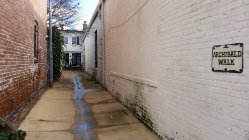 The entrance to Archibald Walk invites passerby to glimpse into a residential alley and part of Washington's past