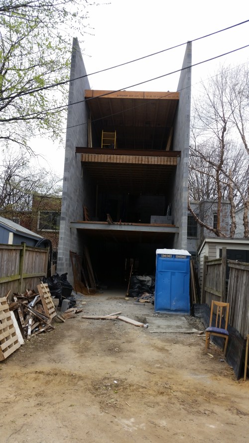 This Is the rear unit in the vertically divided building, whose entrance will be from  the alley connecting to King's Court