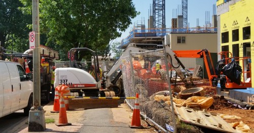 View of the Hine construction entrance  from the north side of 8th Street, looking south.