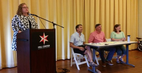 Seated:  Market Row Association Board of Directors, (l-r), Manuel Cortes, Groovy; Terry McDonald, Scallan properties; Mary Quillian Helms, Mr. Henry's; (not pictured) Ann Richards, Forecast.  Standing is Kate Gordon,  meeting facilitator