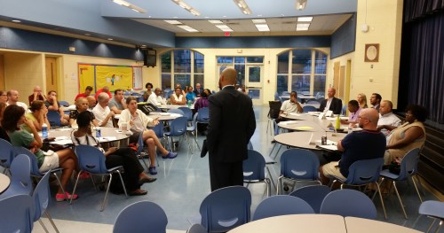 White fields a question from resident Elizabeth Nelson