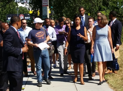 Mayor Bowser, flanked by ANC Commissioners Daniel Ridge and Denise Krepp on East Capitol Street Tuesday afternoon, enroute to Hill East's former Boys and Girls Club
