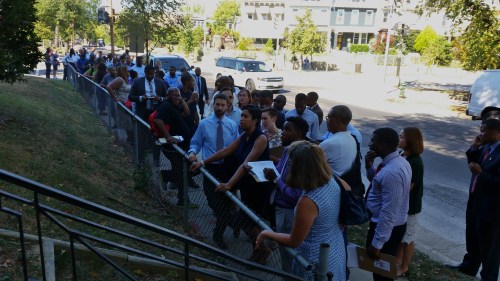 Bowser and CM Allen in front of the Boys and Girls Club, discussing the next step.