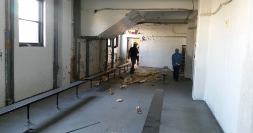 Headed through what was once maybe a locker room toward the basketball court on the south end of the building.