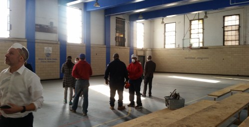 The basketball court.  Note the basket of copper pipes collected by metal thieves who have recently broken into the building.  (Separate post on this to follow.)