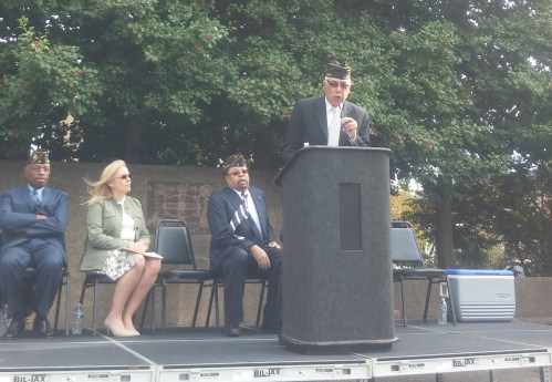 Herman "Rip" Preston, Jr., Commender Kenneth H. Nash Post No. 8, welcomes the crowd and remembers the veterans. 