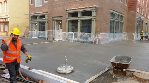 The Hine Project''s North Building got sidewalks last week, in a rush to complete the residential portion of the building by year's end.  Photo on December 23, 2016.